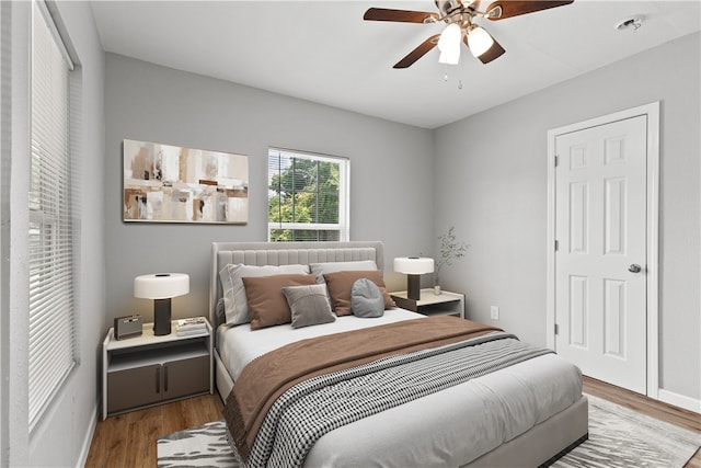 bedroom featuring ceiling fan and wood-type flooring