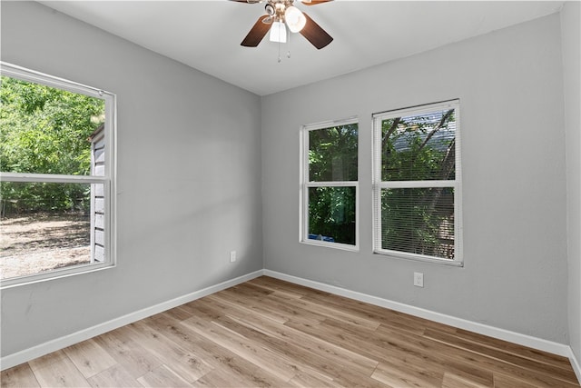 unfurnished room with light wood-type flooring and ceiling fan