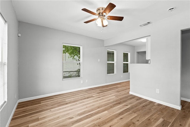 unfurnished room featuring light wood-type flooring and ceiling fan