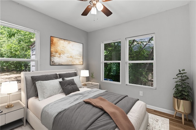 bedroom featuring hardwood / wood-style floors and ceiling fan