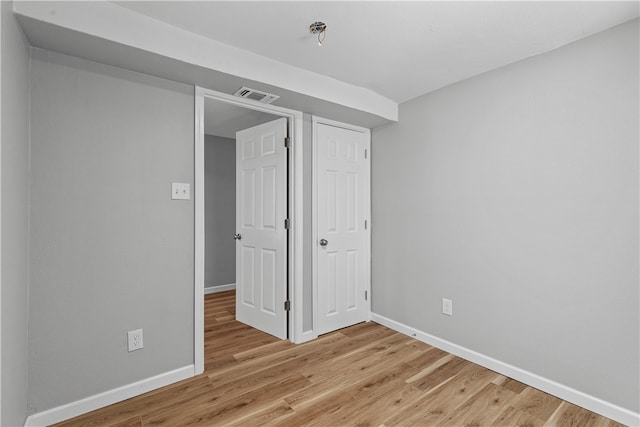 unfurnished bedroom featuring light hardwood / wood-style floors