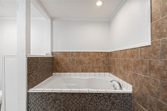 bathroom featuring tiled bath, crown molding, and toilet