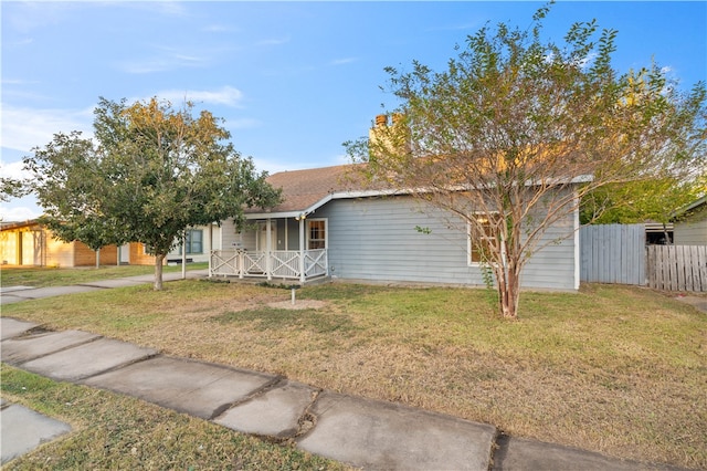 view of front of home with a front lawn and a porch