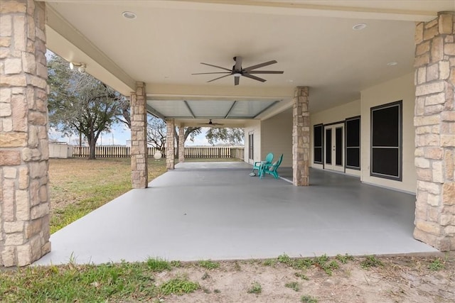 view of patio / terrace with french doors, ceiling fan, and fence