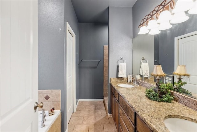 full bathroom featuring tile patterned flooring, a washtub, a sink, baseboards, and double vanity