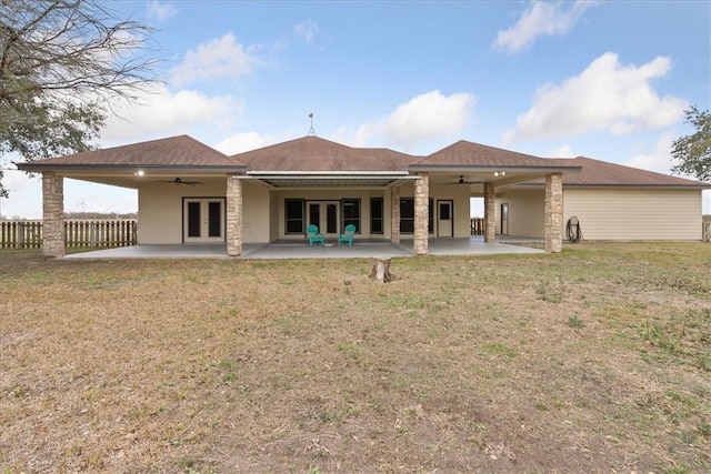 rear view of house with french doors, a patio area, and ceiling fan