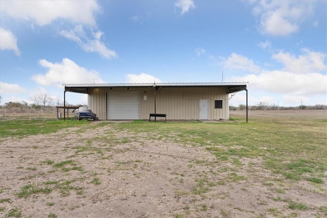 view of pole building featuring driveway