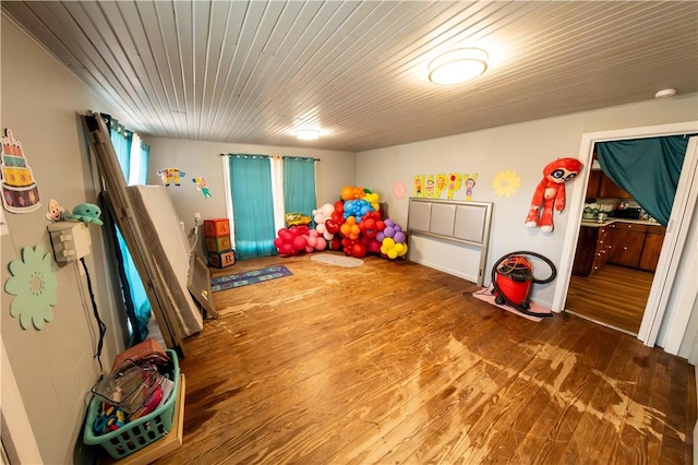 rec room with wood ceiling and wood finished floors