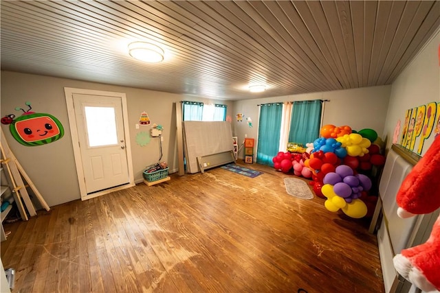 playroom featuring wooden ceiling and wood finished floors