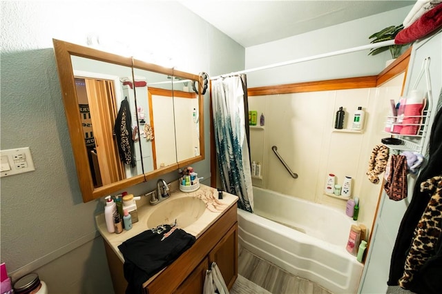 bathroom with shower / tub combo and vanity