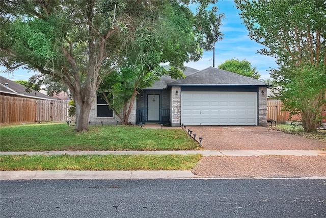 ranch-style home with a garage and a front yard