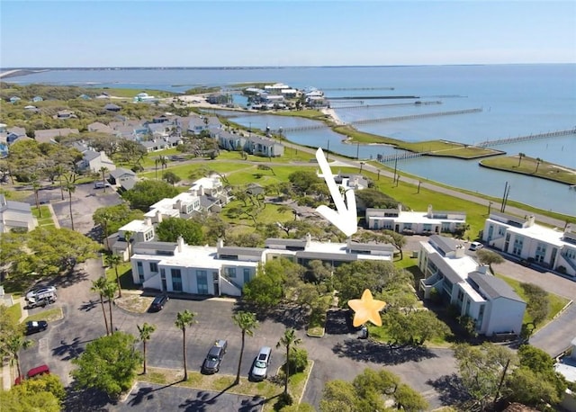 drone / aerial view with a water view and a residential view