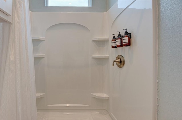 bathroom featuring a shower with curtain