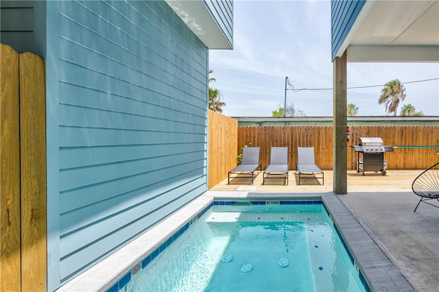 view of swimming pool featuring grilling area