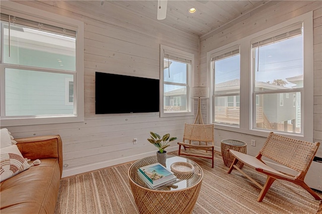 sunroom featuring ceiling fan