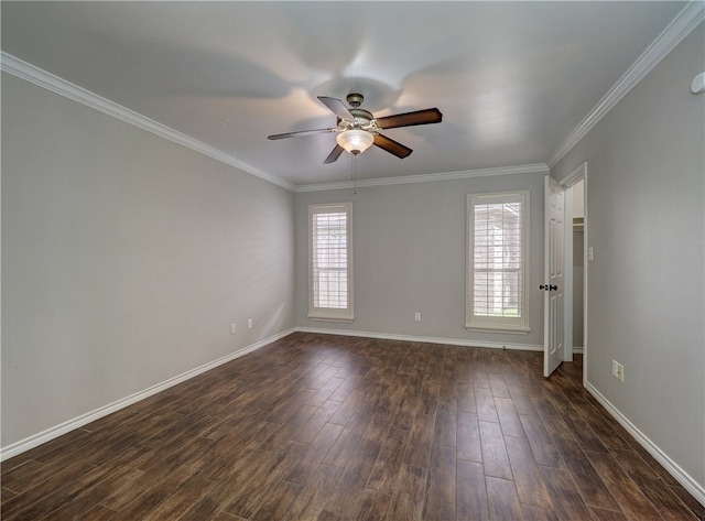 spare room with plenty of natural light, a ceiling fan, dark wood-type flooring, and ornamental molding