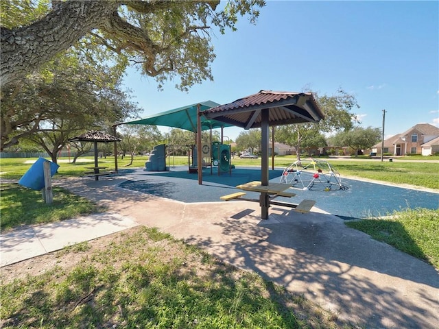 view of property's community featuring playground community, a lawn, and a gazebo