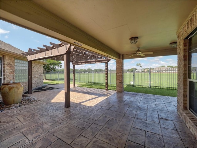 view of patio / terrace with ceiling fan, fence, and a pergola