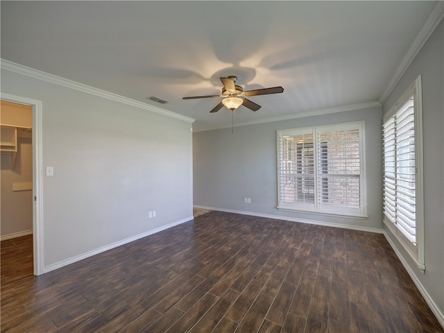 unfurnished room featuring ornamental molding, visible vents, dark wood finished floors, and baseboards