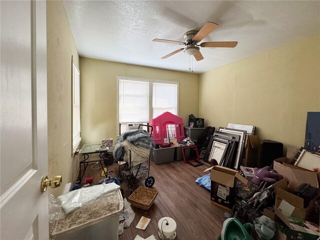 769 W Cornelia, Corpus Christi, TX 78408 - bedroom with wood finished floors, ceiling fan, and a textured ceiling