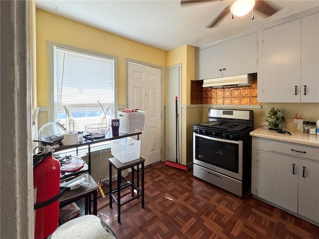 769 W Cornelia, Corpus Christi, TX 78408 - kitchen with gas range, under cabinet range hood, a ceiling fan, light countertops, and white cabinets