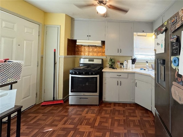 769 W Cornelia, Corpus Christi, TX 78408 - kitchen with stainless steel appliances, under cabinet range hood, light countertops, a ceiling fan, and white cabinetry