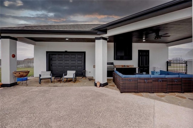 patio terrace at dusk with grilling area, ceiling fan, and outdoor lounge area