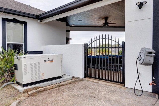 view of gate with ceiling fan