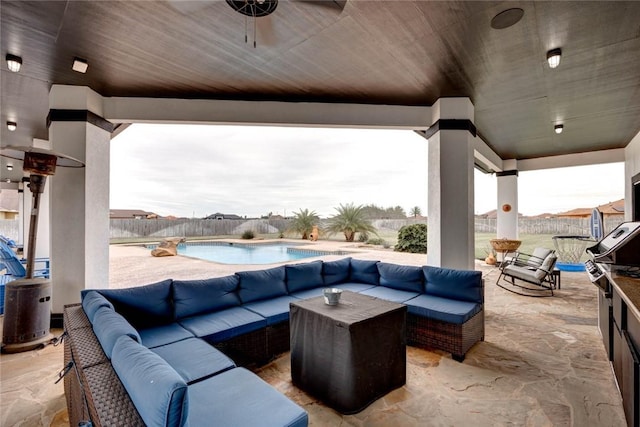 view of patio / terrace featuring ceiling fan, outdoor lounge area, and a covered pool