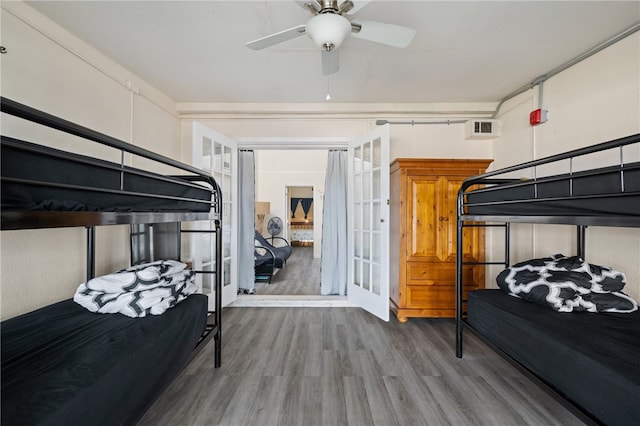 bedroom featuring ceiling fan and wood-type flooring