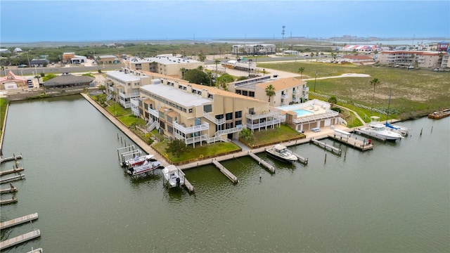 birds eye view of property with a water view