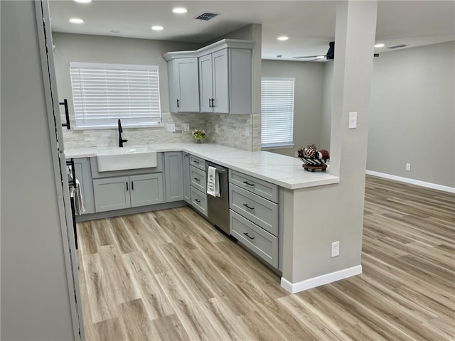 4917 Arlene Dr, Corpus Christi, TX 78411 - kitchen featuring a sink, gray cabinetry, light wood-type flooring, dishwasher, and recessed lighting