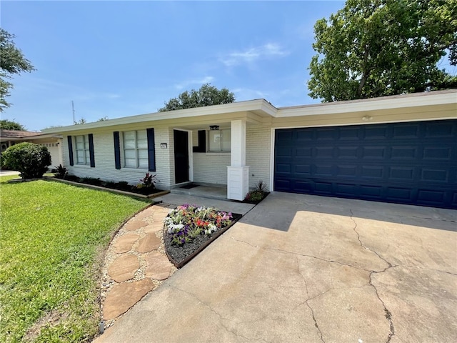 4917 Arlene Dr, Corpus Christi, TX 78411 - single story home with a front lawn, brick siding, driveway, and an attached garage