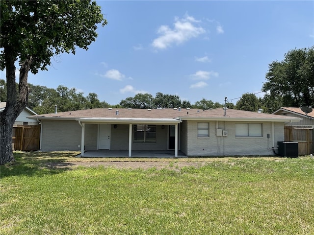 4917 Arlene Dr, Corpus Christi, TX 78411 - rear view of house with a patio, brick siding, and central air condition unit