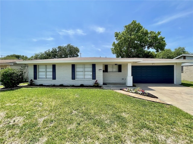4917 Arlene Dr, Corpus Christi, TX 78411 - ranch-style house featuring a garage, brick siding, driveway, and a front yard