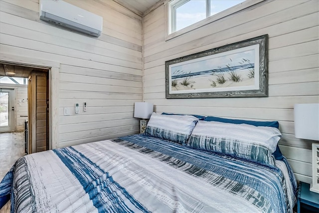 bedroom with multiple windows, wooden walls, and a wall mounted AC