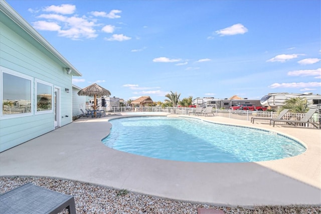 view of swimming pool featuring a patio area