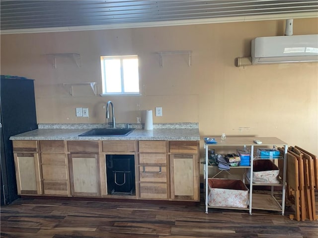 kitchen with a wall mounted air conditioner, dark hardwood / wood-style flooring, crown molding, and sink