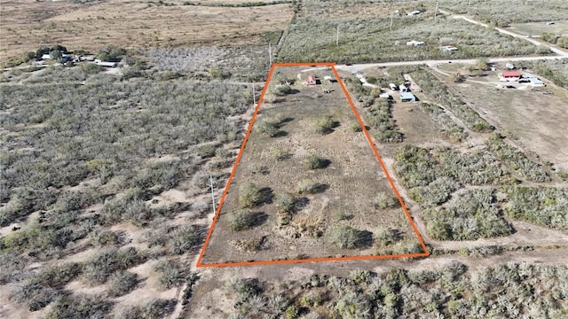 birds eye view of property featuring a rural view