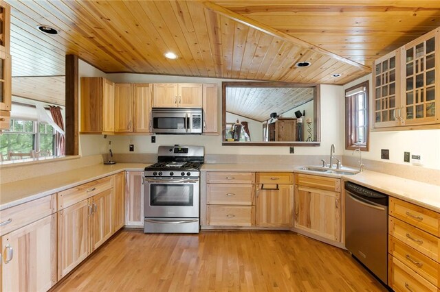 kitchen with light brown cabinetry, wooden ceiling, sink, and stainless steel appliances