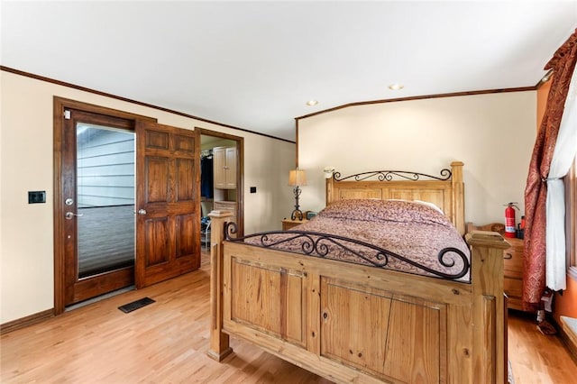 bedroom featuring light hardwood / wood-style flooring and ornamental molding