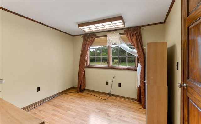 unfurnished room featuring crown molding and light hardwood / wood-style flooring