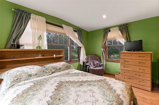 bedroom with wood-type flooring