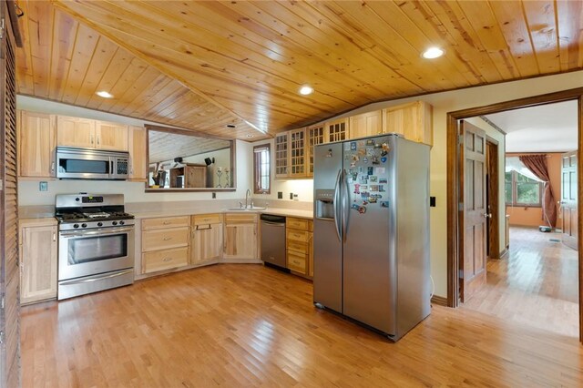 kitchen featuring light brown cabinetry, stainless steel appliances, sink, light hardwood / wood-style flooring, and wooden ceiling