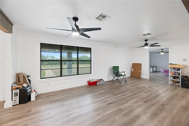 1406 Hwy 72, Three Rivers, TX 78071 - unfurnished living room with a ceiling fan and wood finished floors