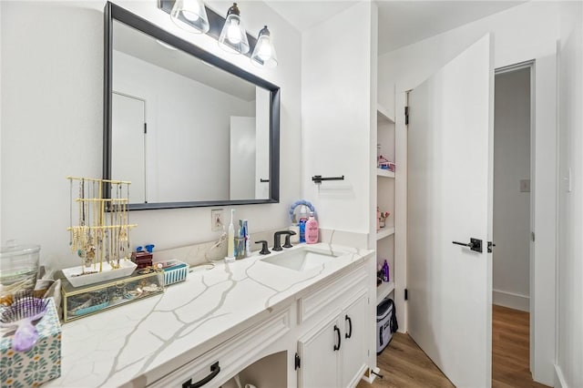 1406 Hwy 72, Three Rivers, TX 78071 - bathroom featuring wood finished floors and vanity
