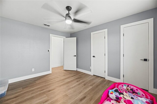 1406 Hwy 72, Three Rivers, TX 78071 - unfurnished bedroom with wood finished floors and a ceiling fan
