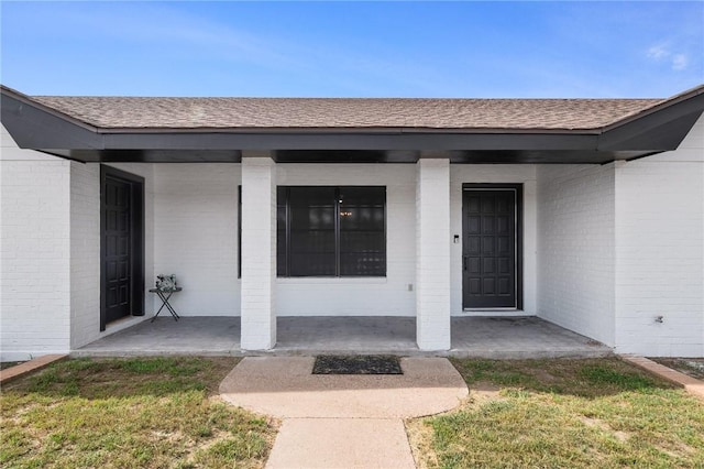 1406 Hwy 72, Three Rivers, TX 78071 - property entrance with brick siding, covered porch, and roof with shingles