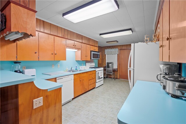 kitchen with white appliances and sink