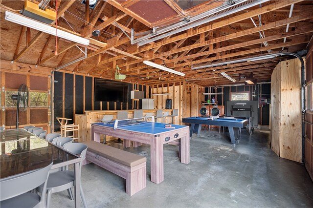 recreation room with concrete floors